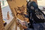 سوخته‌نگاری تمثال چهار شهید در آیین صنایع‌ دستی منطقه ۸ 